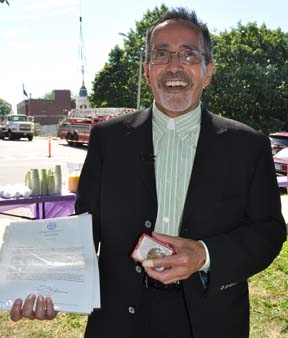 Rev. Art Lavoie: The First Parish minister with items he placed inside a time capsule located near the top of the steeple. Photo by Bill Forry